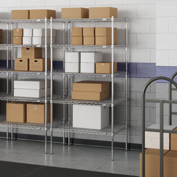 A metal wire shelving unit with boxes on the shelves.