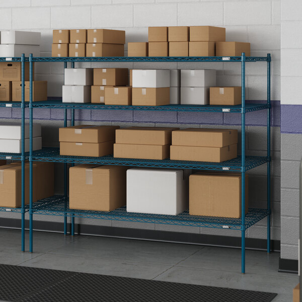 Blue Lavex Pro wire shelving in a warehouse with white boxes on the shelves.