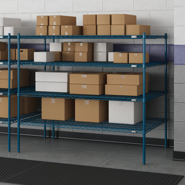 A blue metal Lavex Pro wire shelving unit with brown boxes on it.