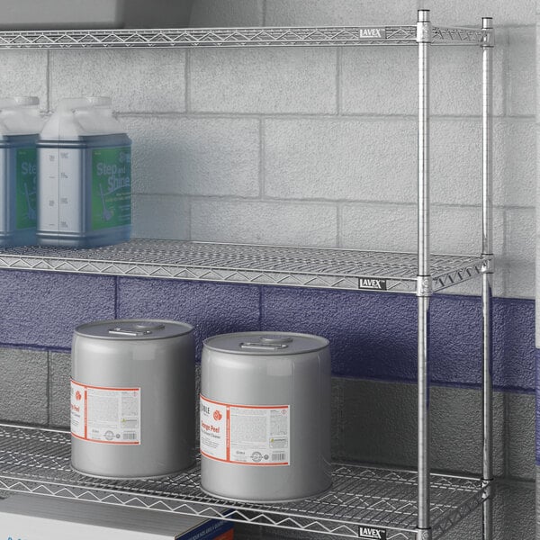 A Lavex Pro chrome metal wire shelf with containers on it.