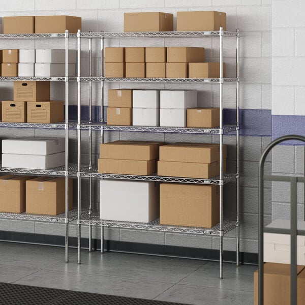 A white rectangular metal wire shelving unit with boxes on the shelves.