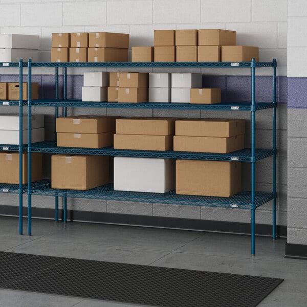 A blue metal Lavex Pro wire shelving unit with boxes on it.