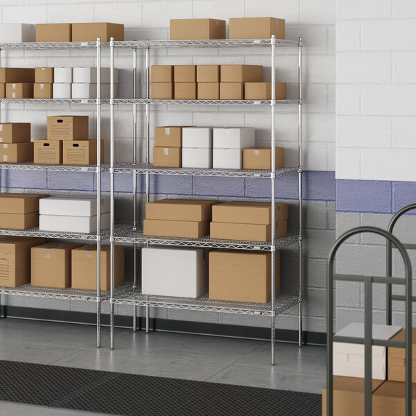 A metal wire shelving unit with boxes on the shelves.