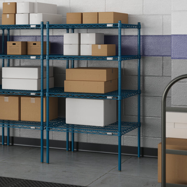 Blue metal wire shelving with white boxes on the shelves.