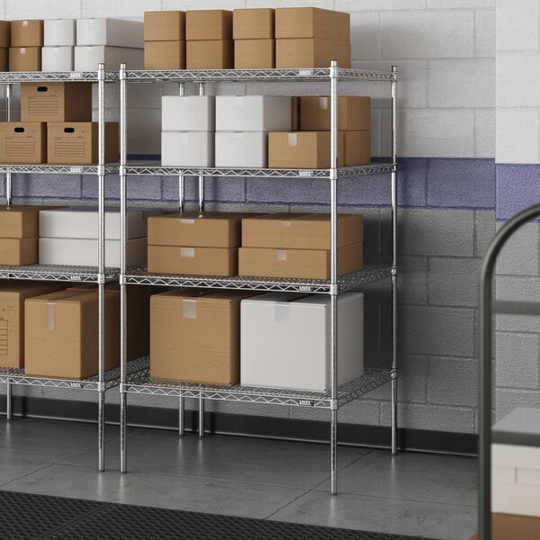 A metal wire shelving unit with white boxes on the shelves.