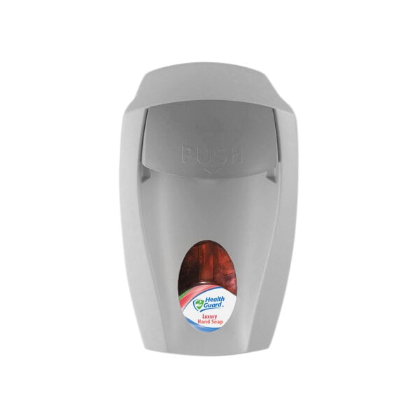 A grey Kutol EZ Foam manual hand soap/sanitizer dispenser with a red label and button.