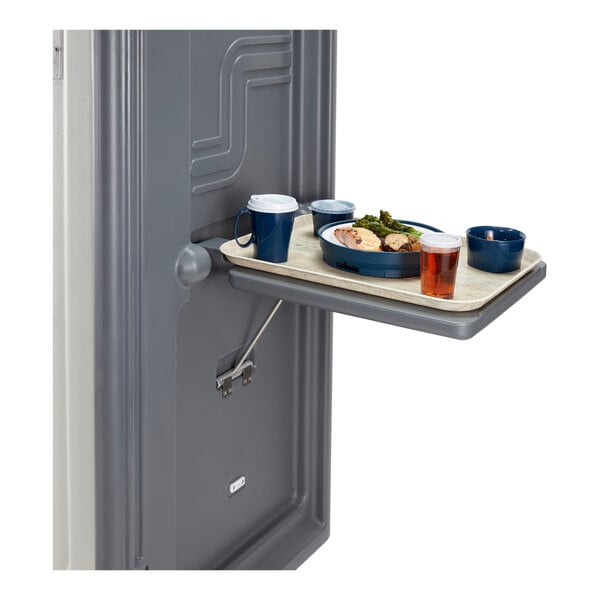 A Cambro granite gray end table with a tray of food and drinks on it.