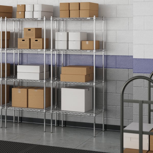 A metal wire shelf with boxes on it.