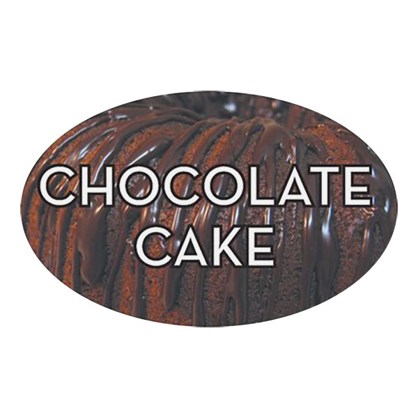 A close up of a white chocolate cake with a Bollin oval chocolate cake label.