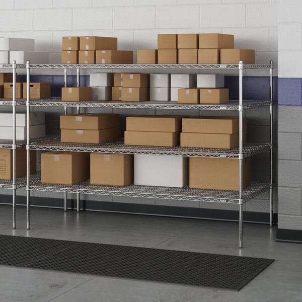 A Lavex Pro wire shelving unit with brown boxes on a shelf.