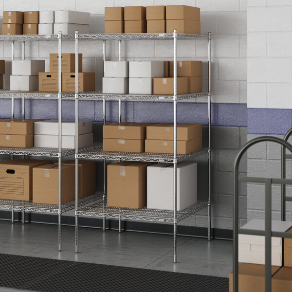 A wire shelving unit with metal shelves and boxes on them.