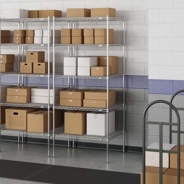 A metal wire shelving unit with boxes on the shelves.