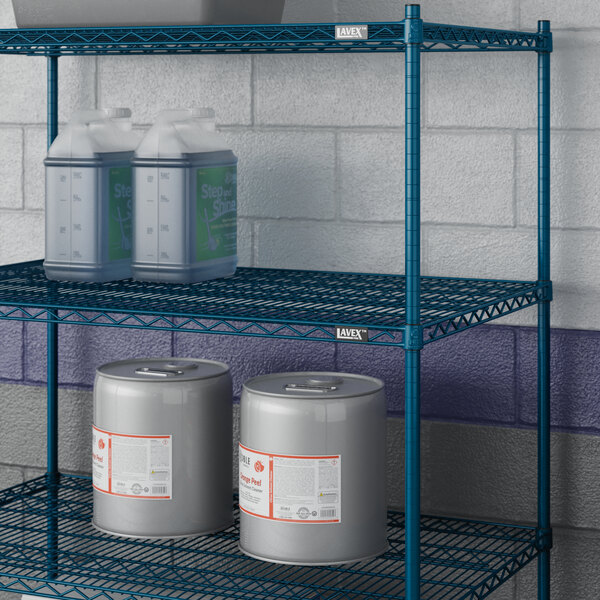 A Lavex Pro blue metal wire shelf in a grocery store aisle with containers and bottles.