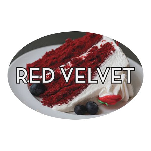 A red velvet cake with white frosting and berries with a Bollin red velvet bakery label on a plate.