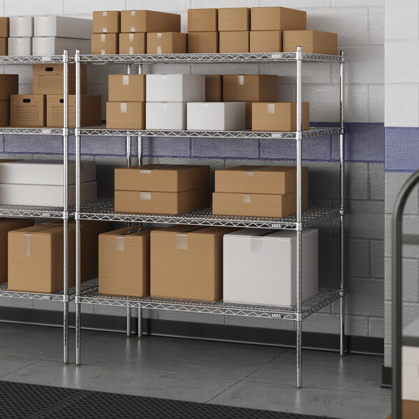 A metal wire shelving unit with boxes on the shelves.