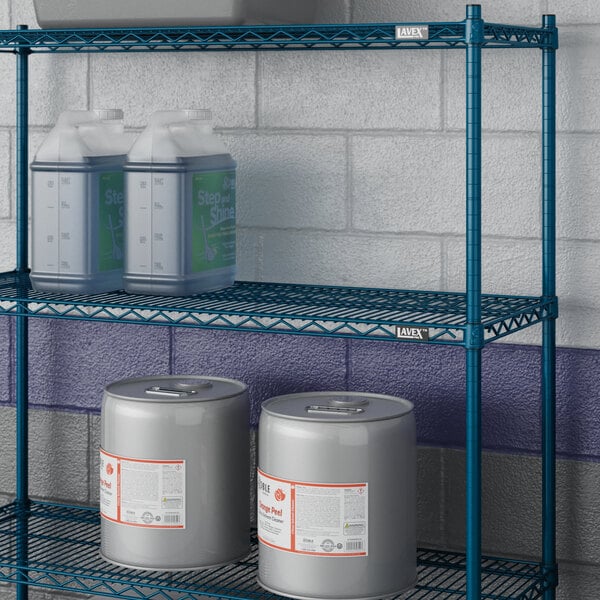 A Lavex Pro blue metal NSF wire shelf holding containers and cans.