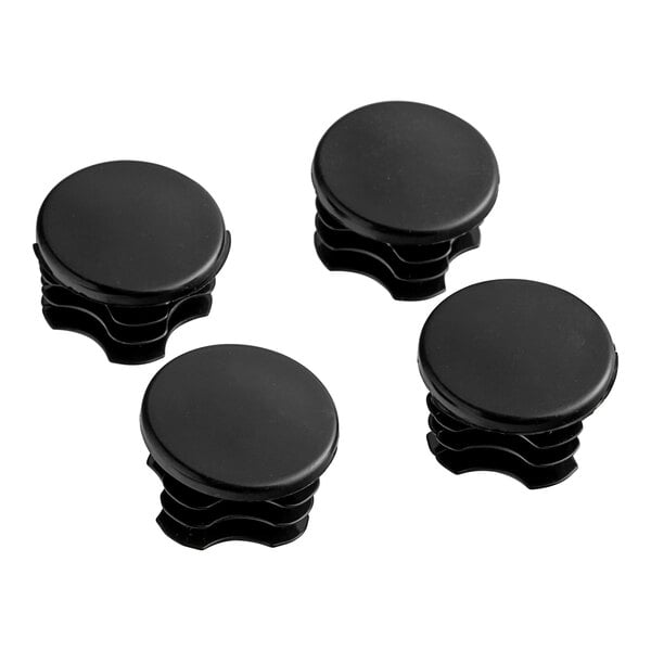 A 4 pack of black plastic Lavex Pro post caps.