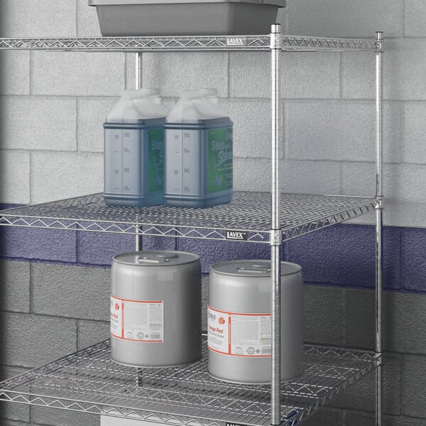 A Lavex Pro NSF chrome wire shelf with metal containers on it.