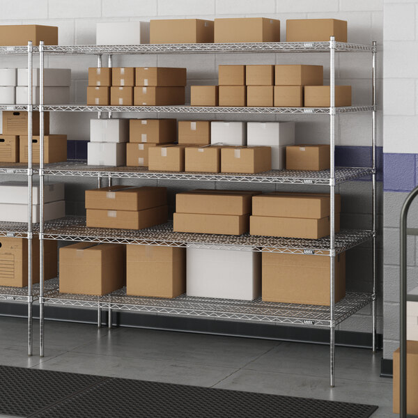 A Lavex Pro metal wire shelving unit with boxes on the shelves.