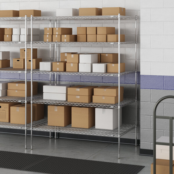 A metal wire shelving unit with boxes on the shelves.