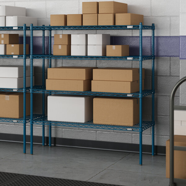 A warehouse with blue Lavex Pro wire shelves holding boxes.