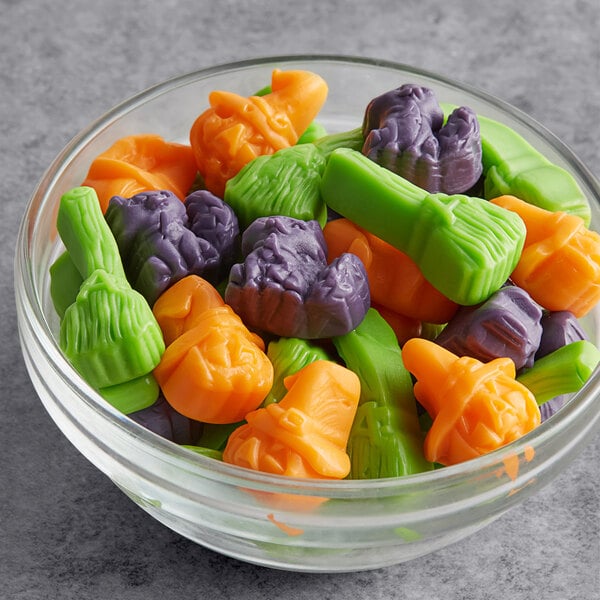A bowl of colorful Albanese Spooktacular Gummi candy pieces.