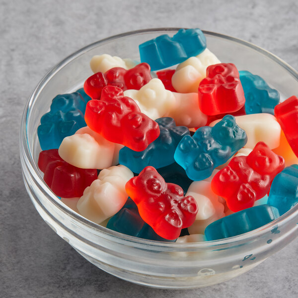 A bowl of Albanese Freedom Gummi Bears with red, white, and blue bears.