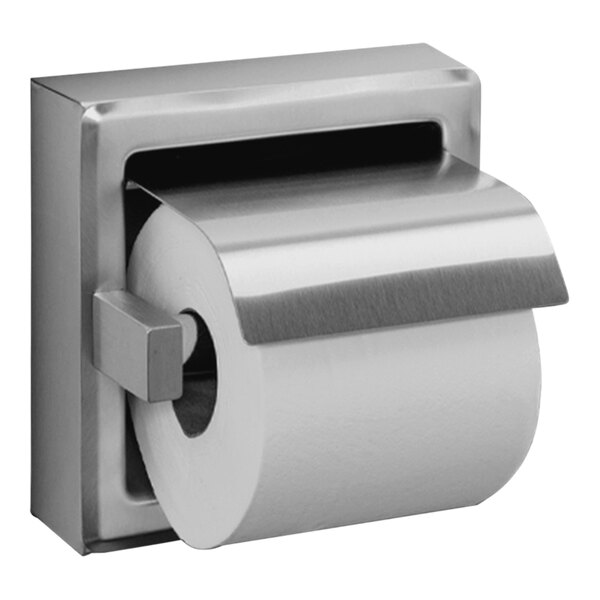 A Bright stainless steel American Specialties, Inc. surface-mounted single roll toilet paper holder with a hood holding a roll of toilet paper.