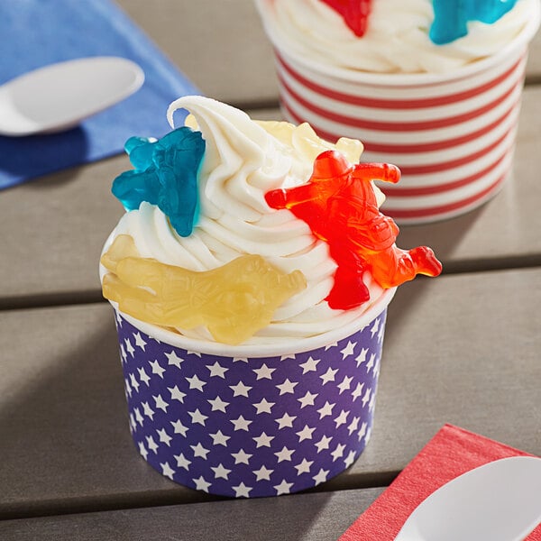 A cup of ice cream with a gummy soldier and a flag on top.