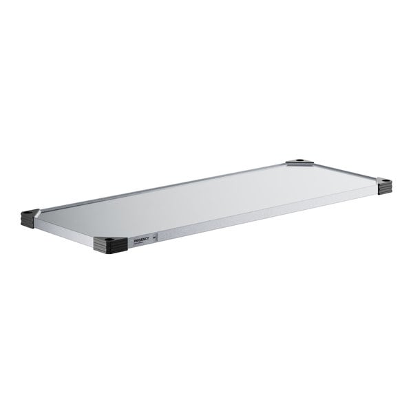 A white rectangular metal shelf.