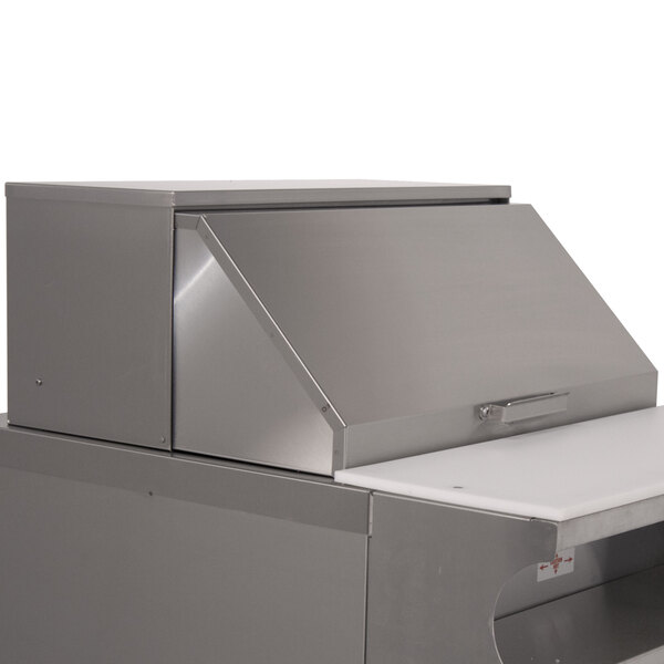A stainless steel Advance Tabco countertop roll cover.