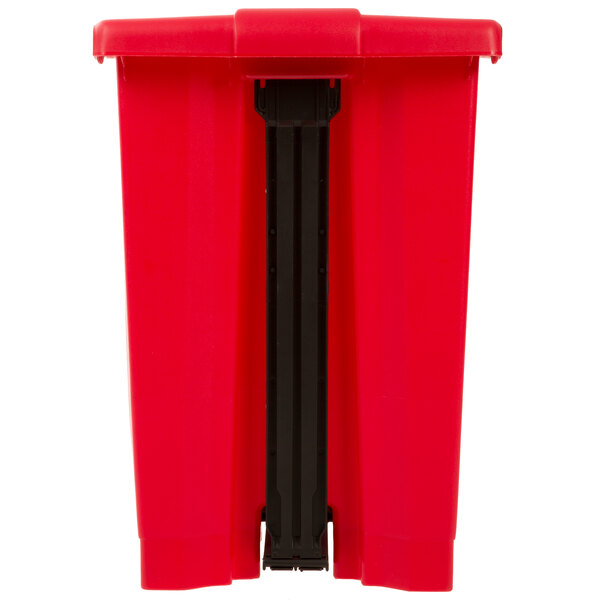 A red rectangular Rubbermaid step-on trash can with black handles.
