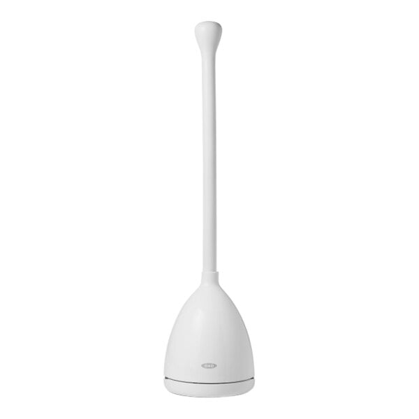 An OXO Good Grips white toilet plunger with a black handle in a white caddy.