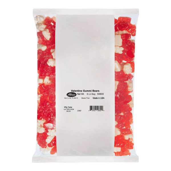 A close up of a plastic bag of Albanese Valentine Gummi Bears with red and white candy inside.