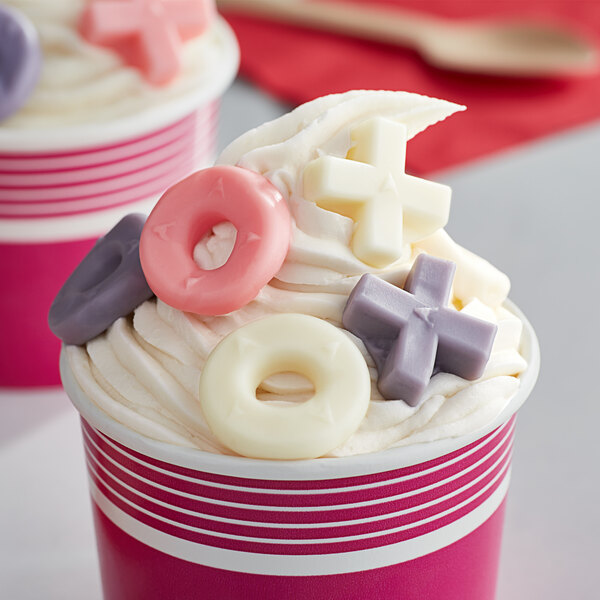 A cup of ice cream with Albanese Valentine gummies on top.