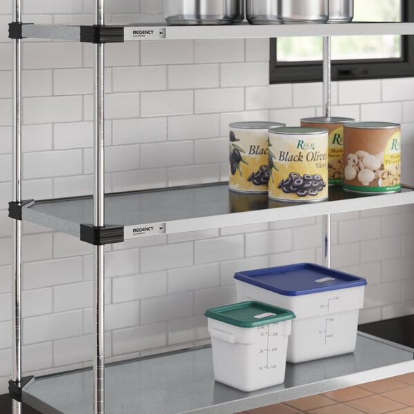 A Regency galvanized steel shelf with cans and containers on it.