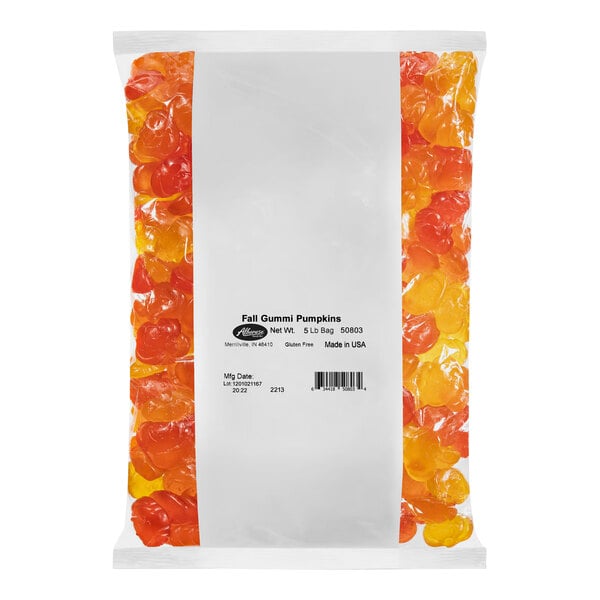 A package of Albanese Fall Gummi Pumpkins with orange and yellow candies inside.