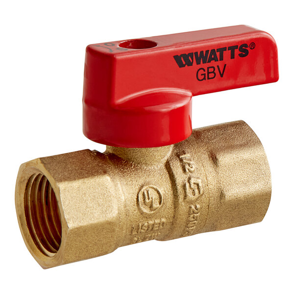A close-up of a Watts brass gas ball valve with a red handle.