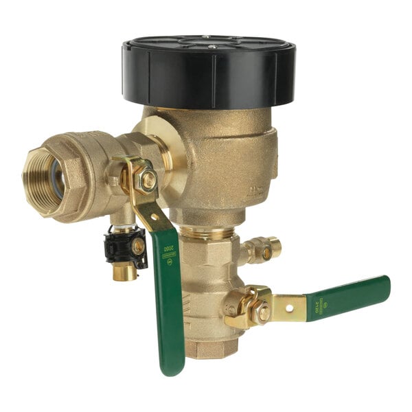 A close-up of a Watts brass anti-siphon pressure vacuum breaker with green and black handles.