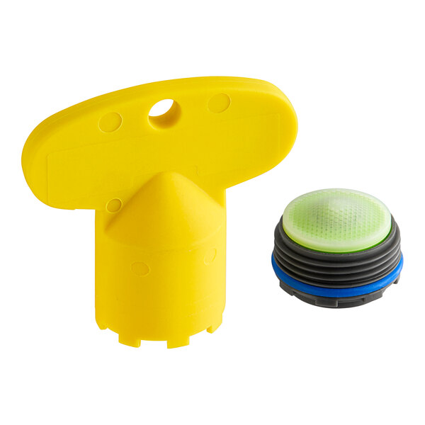 A yellow plastic cap with a round green and black button.