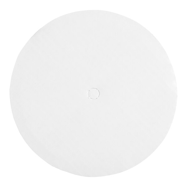 A white circle with a corrugated edge on a white surface.