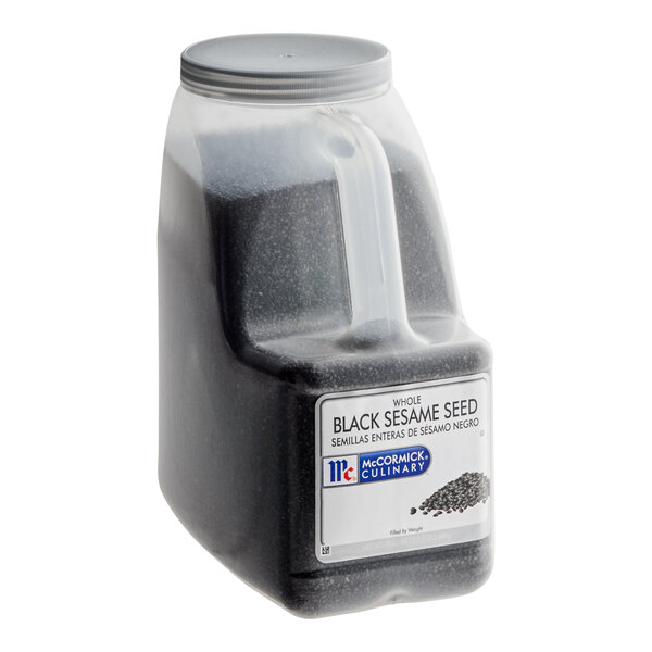 A plastic container of McCormick Culinary black sesame seeds.