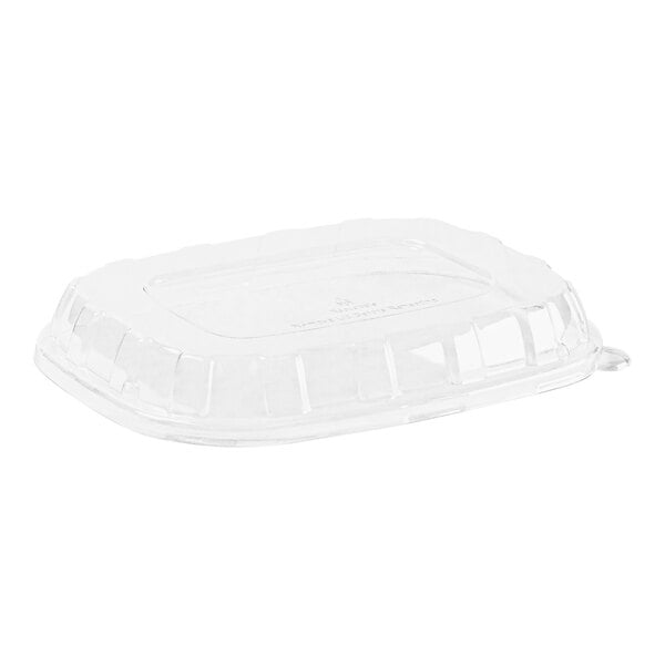 A clear plastic rectangular dome lid on a clear plastic container.