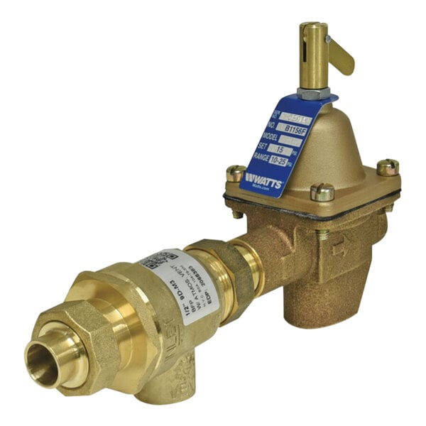 A close-up of a brass Watts combination fill valve and backflow preventer with a blue label.