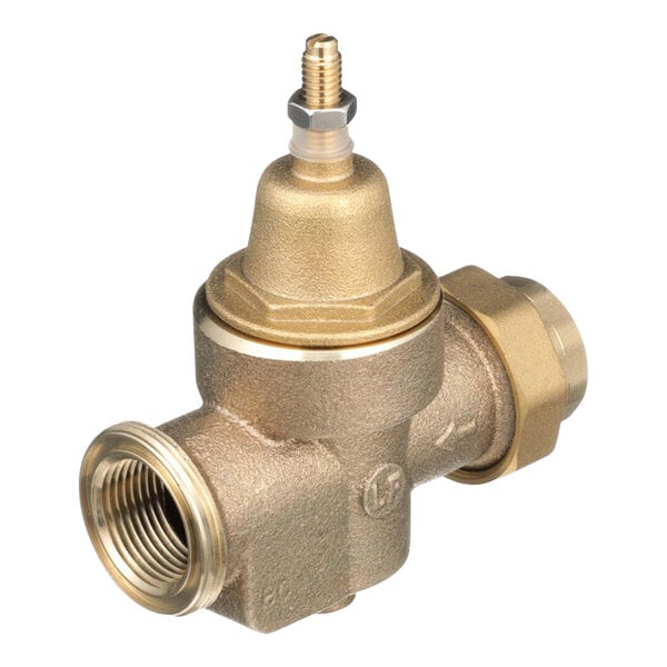 A close-up of a Watts brass water pressure reducing valve with a gold handle and threads.