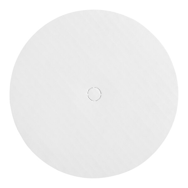A white circular Wilton cake circle with a hole in the center.