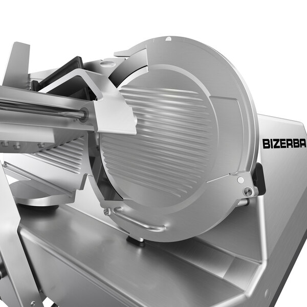 A close-up of the Bizerba heavy-duty meat slicer with a circular metal blade.