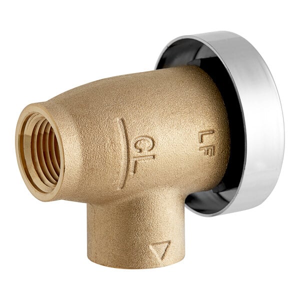 A close-up of a gold and silver Watts brass pipe fitting.