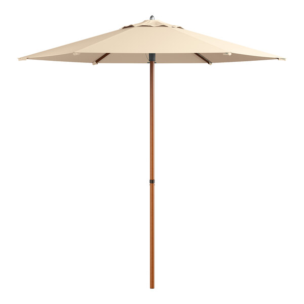 A beige umbrella with a wooden pole and aluminum accents.