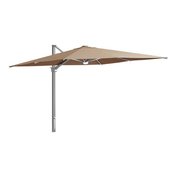 A Lancaster Table & Seating cantilever umbrella with a metal pole and beige shade.